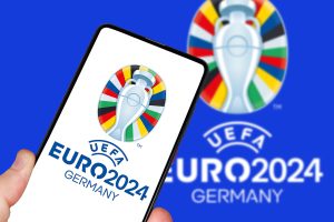 Germany - May 1, 2024: UEFA Euro 2024 Germany European Football Championship Europe logo on a mobile photomontage in Germany.