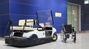 Wheelchair and buggy in airport terminal