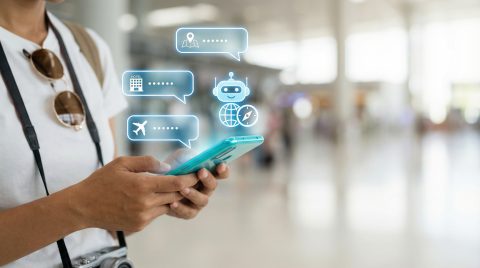 Traveler Using AI Chatbot Assistant on Smartphone for Flight and Hotel Booking, Artificial Intelligence Virtual Concierge for Travel Planning and Navigation Concept